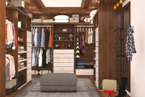 Brown wooden closet with clothes