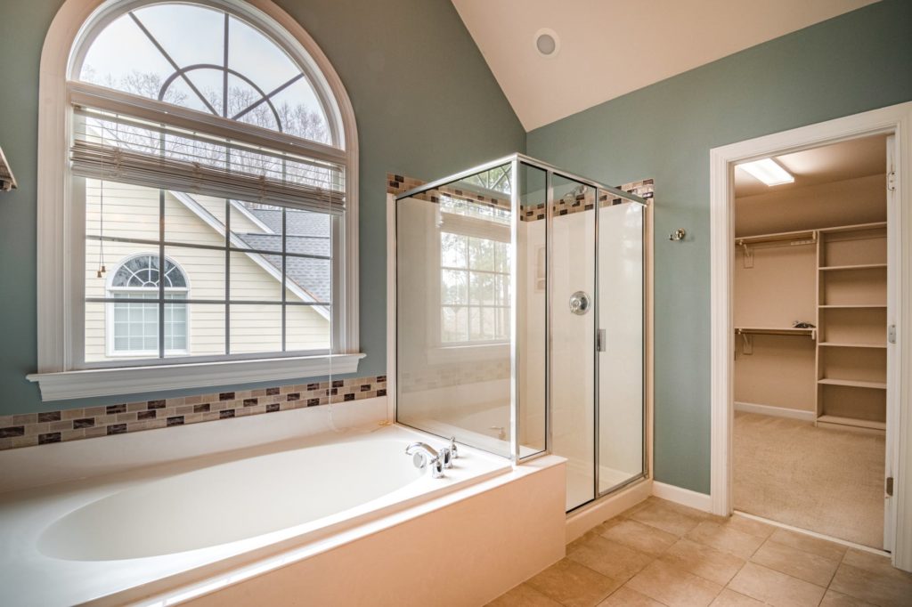 master bathroom with bathtub