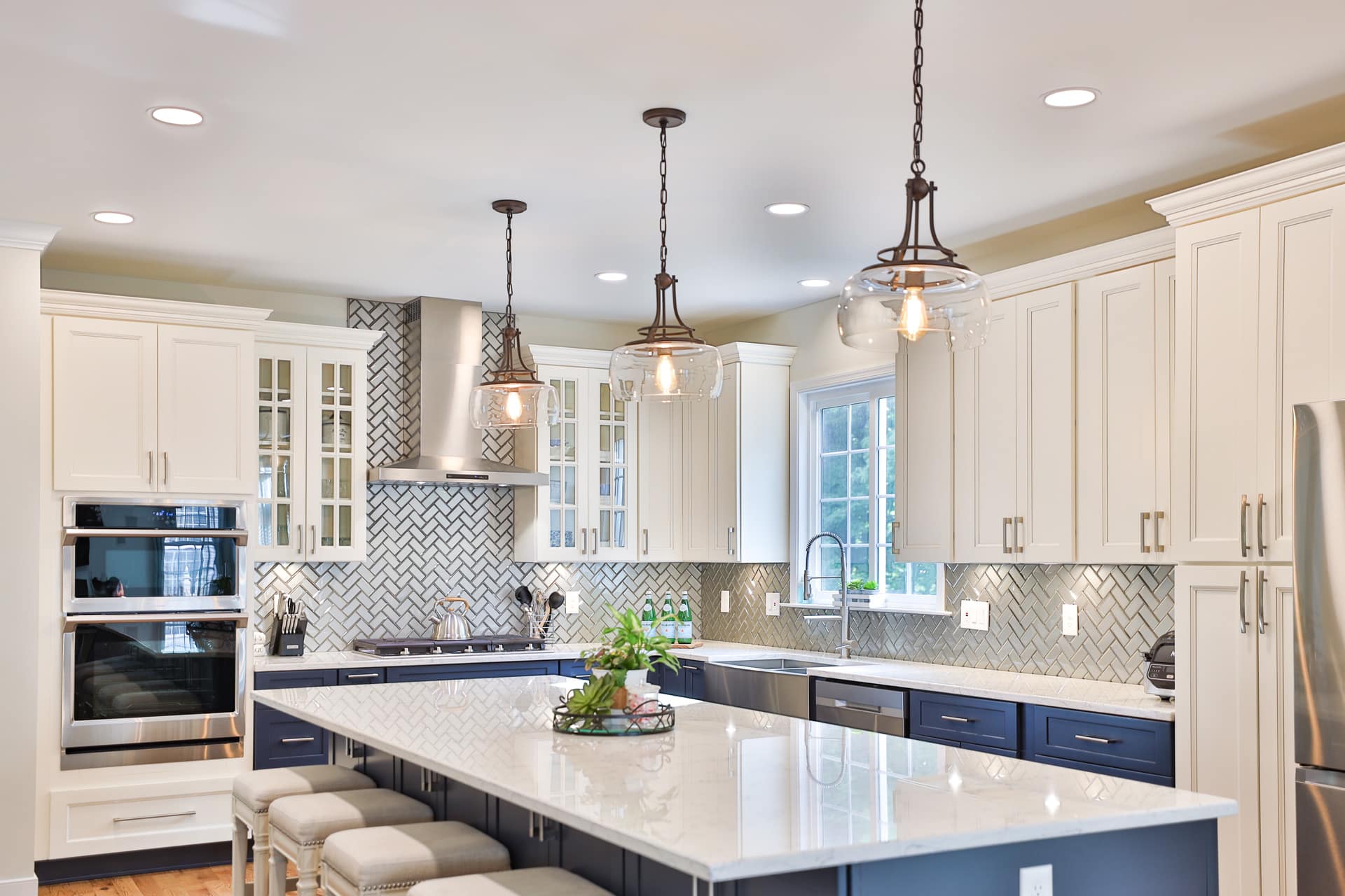 Neptune - There's no doubt that a neutral kitchen will stand the test of  time. And worry not, neutral never has to mean boring. A tiled splashback  in a herringbone design adds