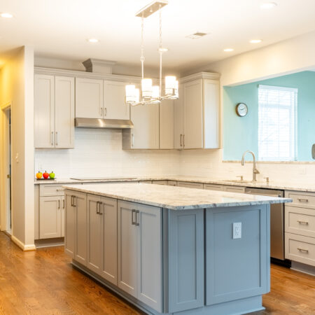 Exquisite kitchen remodel in Leesburg featuring a spacious island, custom cabinetry, quartz countertops, and modern lighting by Kitchen and Bath Shop