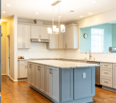 Exquisite kitchen remodel in Leesburg featuring a spacious island, custom cabinetry, quartz countertops, and modern lighting by Kitchen and Bath Shop