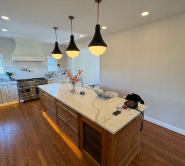 Renovated kitchen in New Market with warm lighting, modern cabinetry, and a cozy, inviting atmosphere.