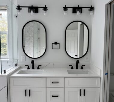 White bathroom with sleek design, modern fixtures, and soft lighting